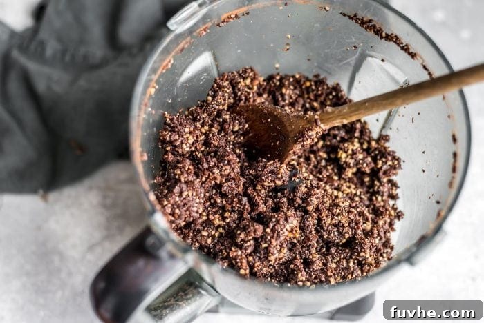 Chocolate Coconut Recharge Bites 3 Blended mixture for no-bake chocolate cashew coconut balls.