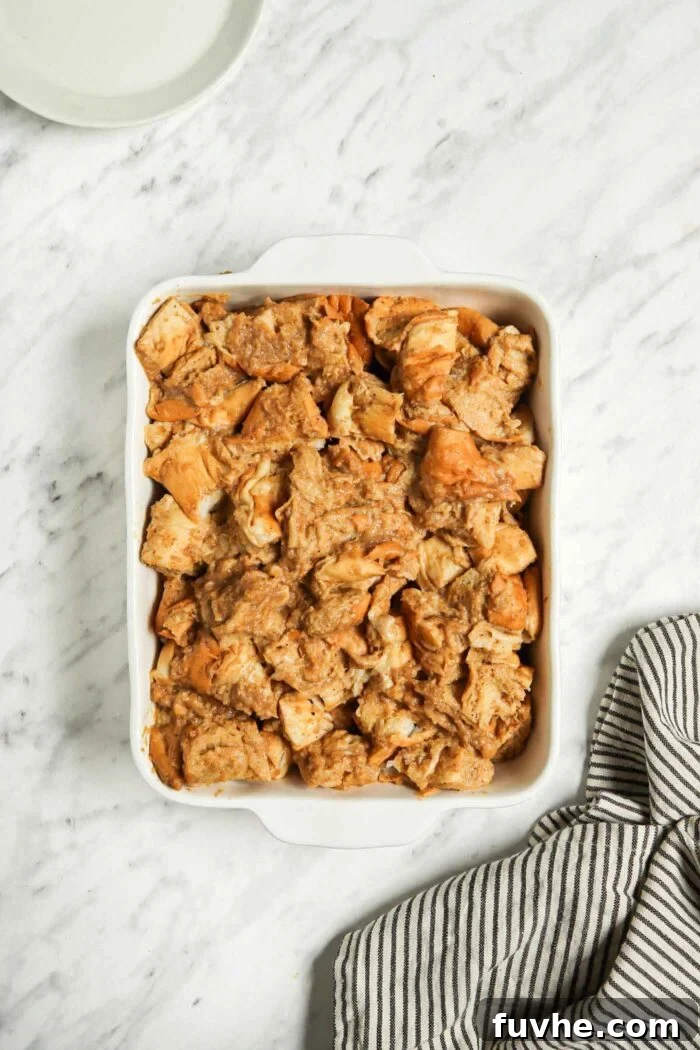 Unbaked french toast casserole in a rectangular casserole dish.