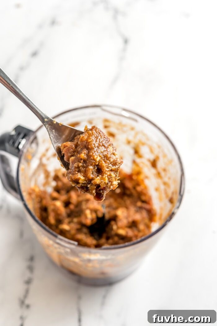 Quick and Easy No-Bake Pecan Tartlets 6 Blended pecan pie filling on a spoon.