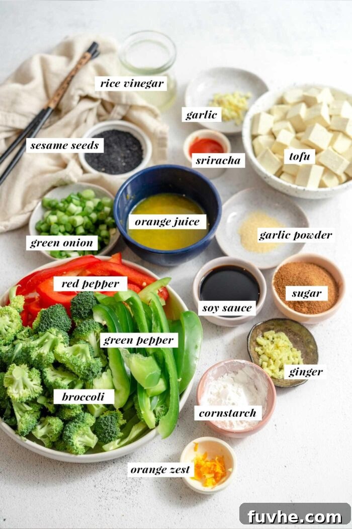 Visual list of all ingredients needed for making a vegan orange tofu recipe.