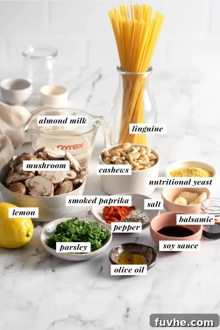 Plant-Based Carbonara 3 All ingredients needed for making a vegan cabonara recipe in containers on a marble surface. Each ingredient is labelled with text.