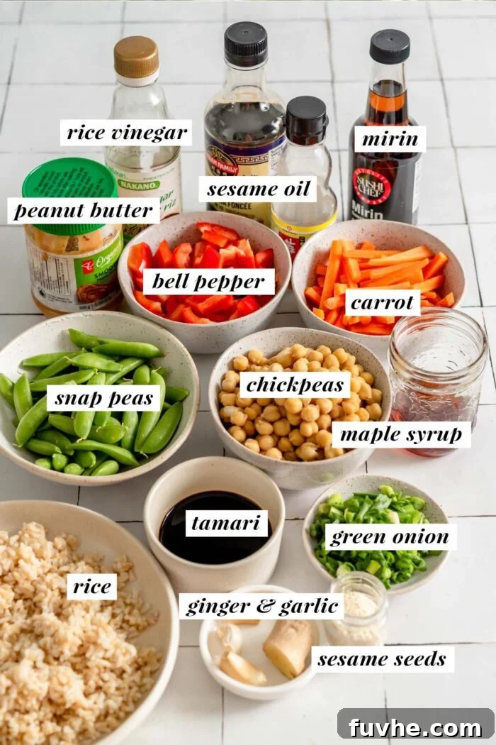 An array of fresh, vibrant ingredients meticulously laid out, including bowls of tamari, maple syrup, rice vinegar, mirin, cornstarch slurry, and peanut butter. Also visible are fresh ginger, garlic cloves, a can of chickpeas, green onions, crisp snap peas, matchstick carrots, and sliced red bell pepper, ready for preparing a delicious teriyaki chickpea rice bowl.