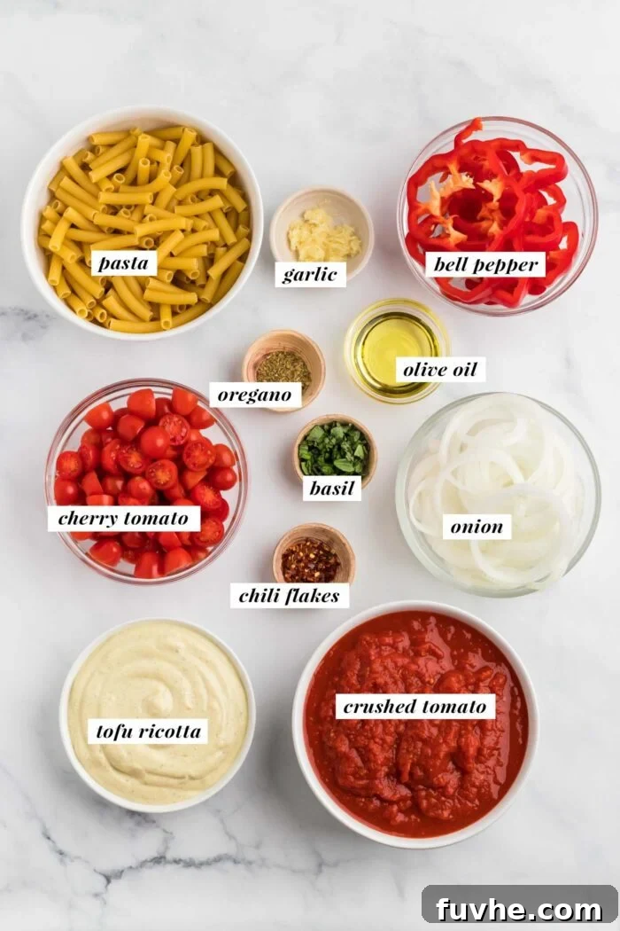 Hearty Plant-Based Baked Ziti 3 The ingredients needed for making a vegan baked ziti recipe, each carefully arranged.