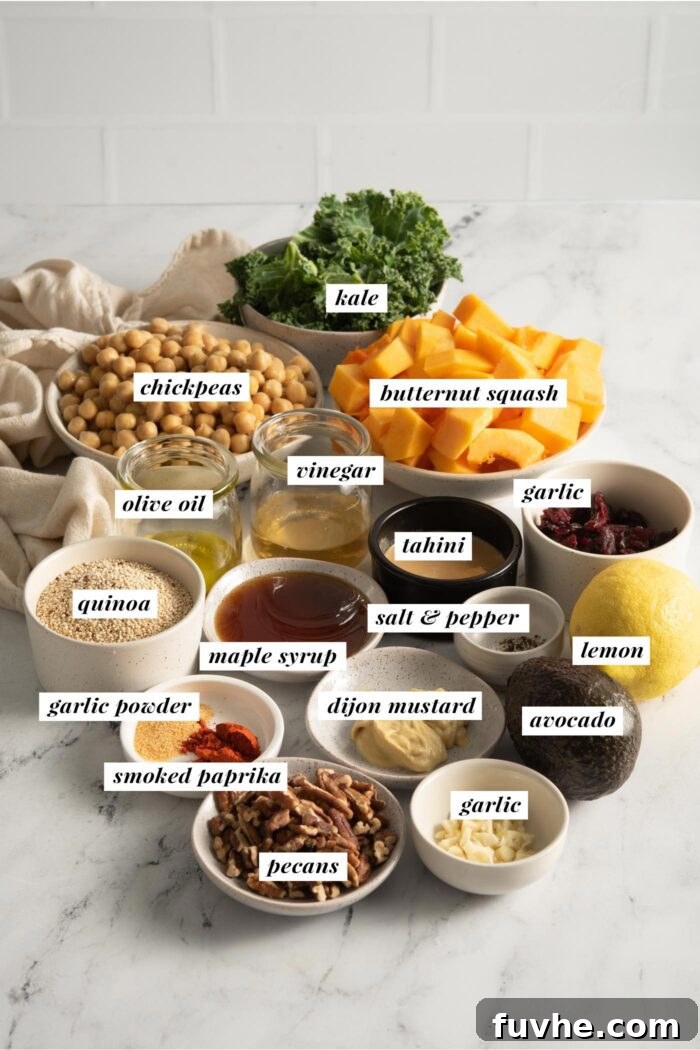 Vibrant Vegan Quinoa Fuel Bowls 3 All the fresh ingredients laid out for assembling a vegan quinoa power bowl recipe, including butternut squash, kale, avocado, pecans, cranberries, and chickpeas.