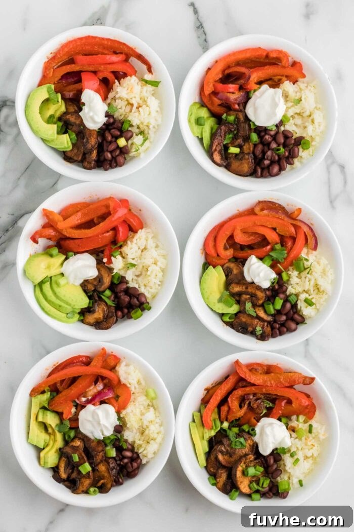 Zesty Plant-Powered Fajita Bowls 9 6 vegetarian fajita bowls with rice, black beans, mushrooms and cooked peppers and onions. Each is topped with sliced avocado and cilantro..