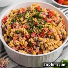 Chipotle Lime Vegan Pasta Salad 10 Overhead view of a large bowl of vegan southwest pasta salad with cilantro, black beans, corn, bell pepper and chipotle dressing..
