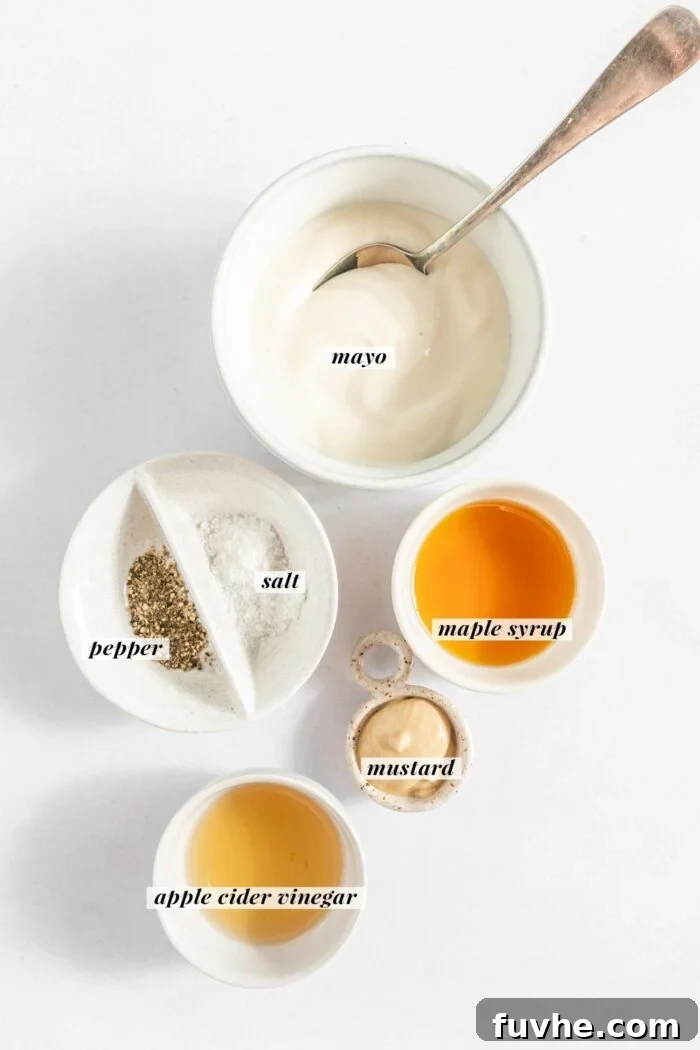 Small dishes containing ingredients for the creamy dressing: vegan mayonnaise, maple syrup, Dijon mustard, apple cider vinegar, salt, and pepper. Each ingredient is clearly labeled.