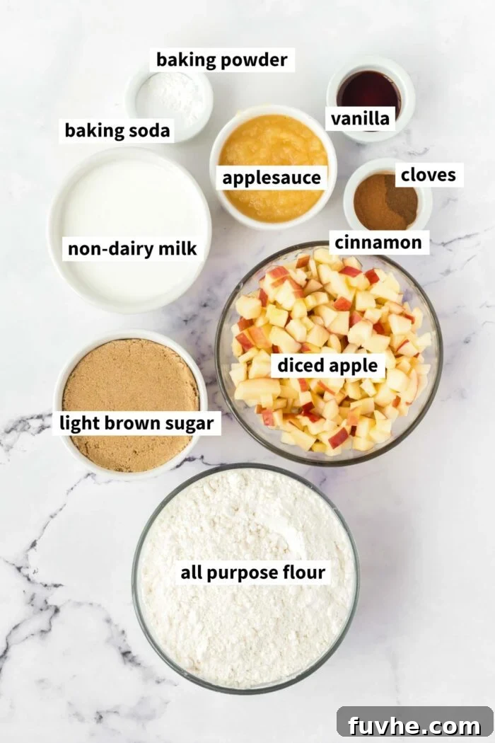 A visual ingredient list of the ingredients for vegan apple cake gathered in bowls and labelled with text.