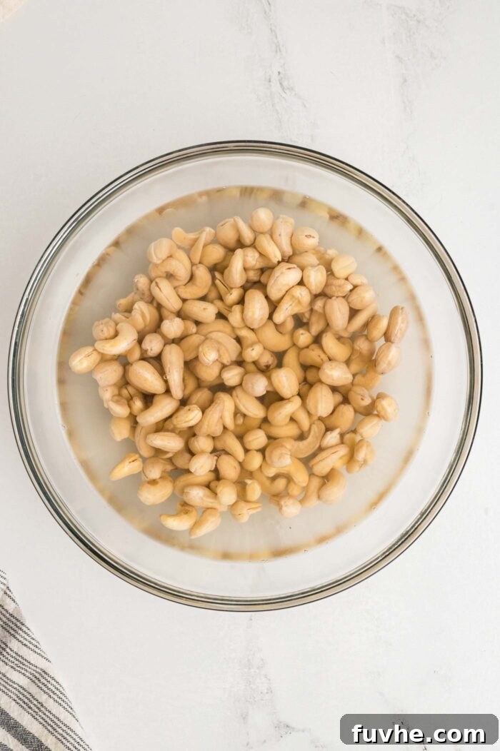 Decadent Vegan Tiramisu 4 Raw cashews soaking in water a glass bowl.