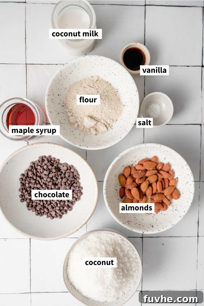 Plant-Powered Almond Coconut Dreams 3 Almond macaroon ingredients gathered in bowls and labelled with text overlay. See the recipe card in the corresponding blog page for the list of ingredients.