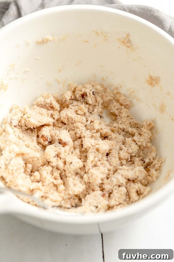 Plant-Powered Almond Coconut Dreams 5 Crumbly coconut and almond macaroon cookie dough in a mixing bowl.