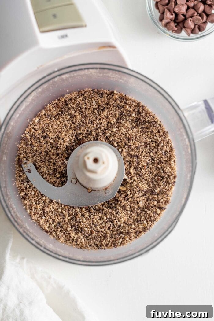 Raw cashews and coffee beans blended together in a food processor.