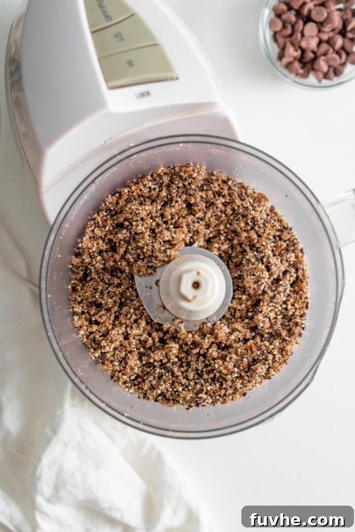 Crumbly, sticky energy ball dough in a food processor.