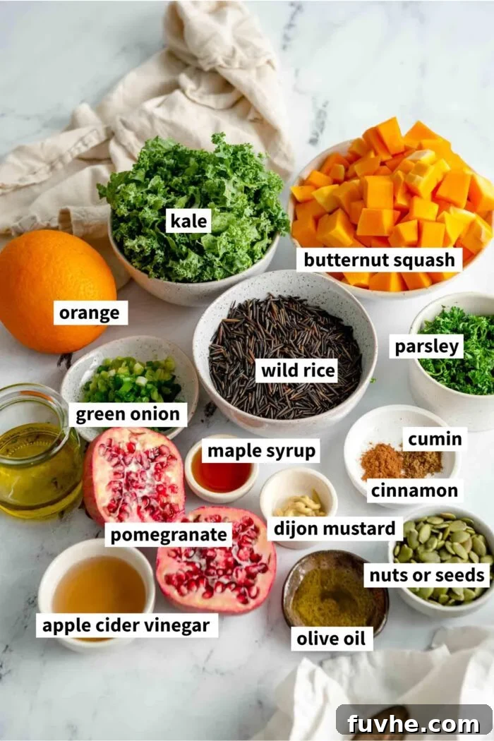 Rustic Wild Rice Salad 3 All the ingredients gathered for making a wild rice salad with kale, pomegranate, pumpkin seeds, wild rice and butternut squash, neatly arranged.