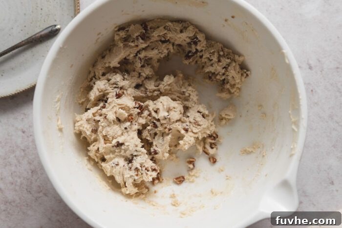 Melt-in-Your-Mouth Vegan Pecan Snowballs 6 Raw pecan snowball dough in a mixing bowl.