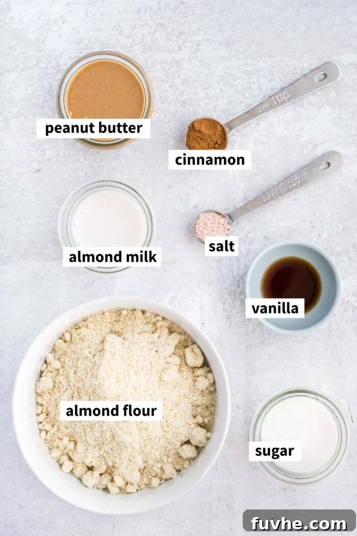 Spoonable Peanut Butter Cookie Dough 3 All the necessary ingredients, including almond flour, peanut butter, and sweeteners, neatly arranged for making edible cookie dough.