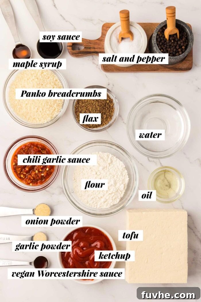 A beautifully arranged selection of fresh ingredients required for making a homemade vegan tofu katsu recipe, including tofu, panko, and sauce components.