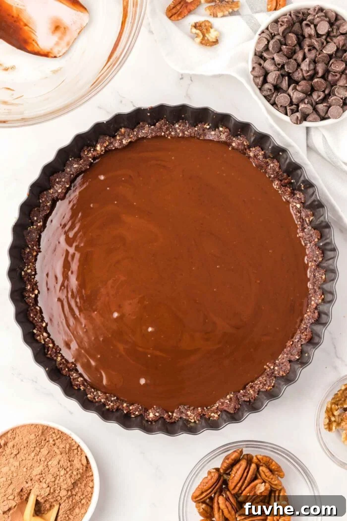A chocolate ganache tart before it has chilled and set.
