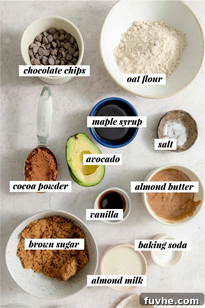 Decadent Vegan Avocado Brownies 3 All the ingredients needed for making a vegan avocado brownie recipe with oat flour, brown sugar, maple syrup and chocolate chips.