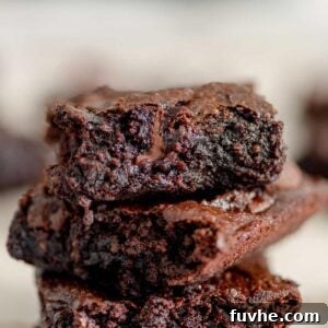 A stack of 3 chocolate chip brownies.