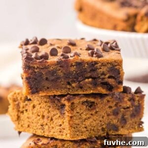A stack of 4 healthy vegan pumpkin chocolate chip bars.