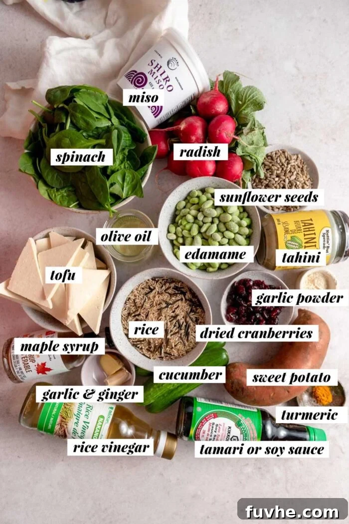 All the ingredients for making vegan veggie power bowls with tofu, radish, cucumber, rice and sweet potato. Each ingredient is labelled with text overlay.