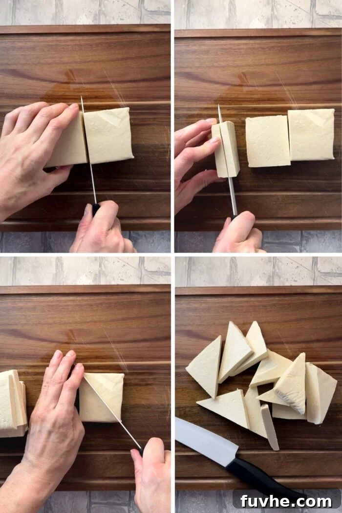 A block of tofu being cut into triangles.