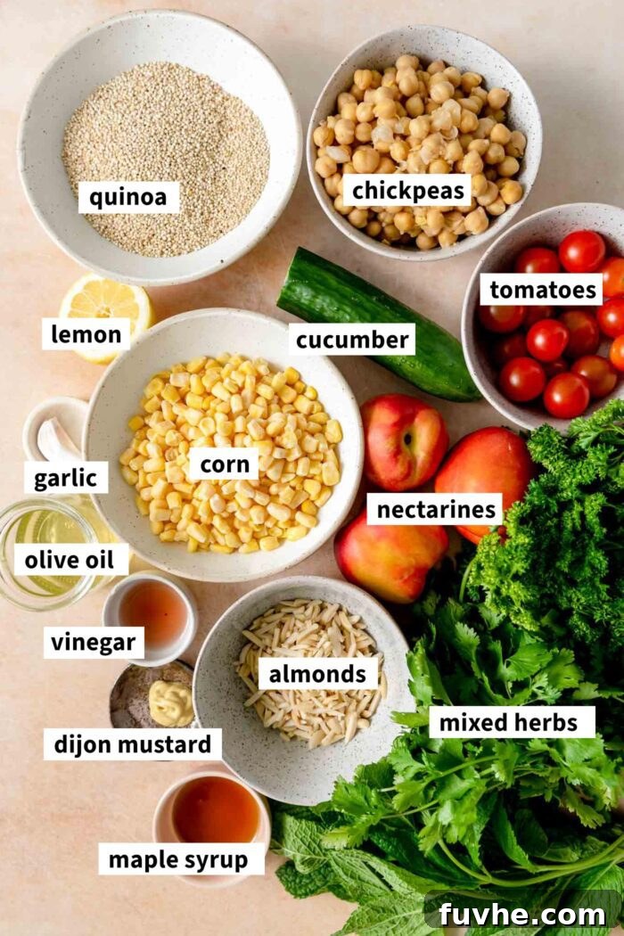 All the ingredients for a summer quinoa salad recipe gathered in bowls and each labelled with text overlay.