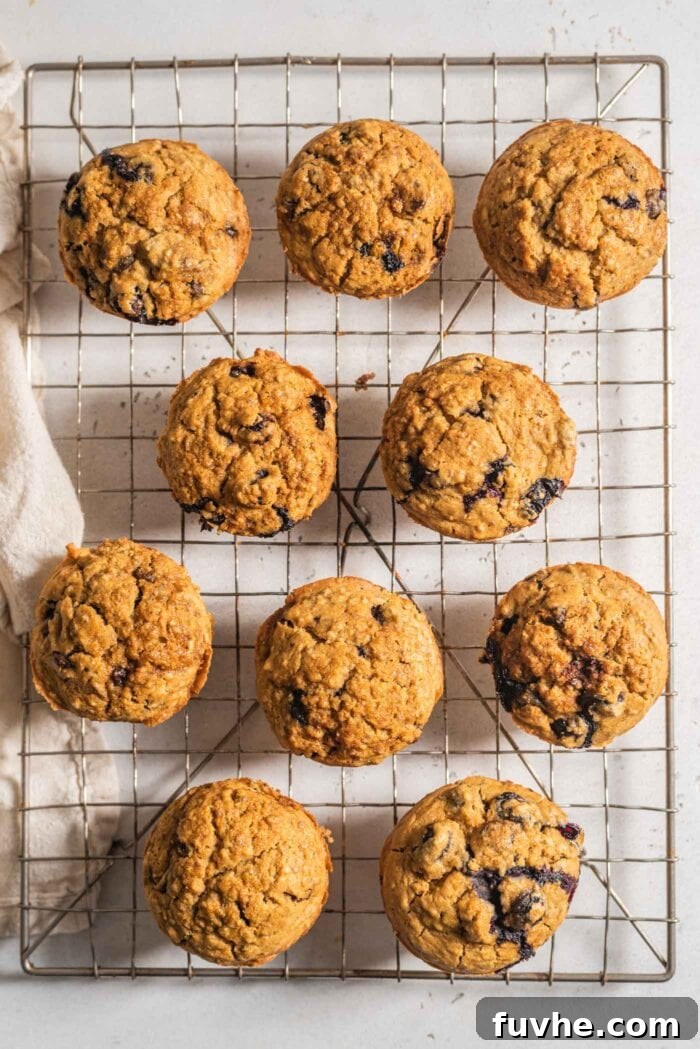 Overhead view of 9 garbanzo bean flour muffins on a cooling rack.