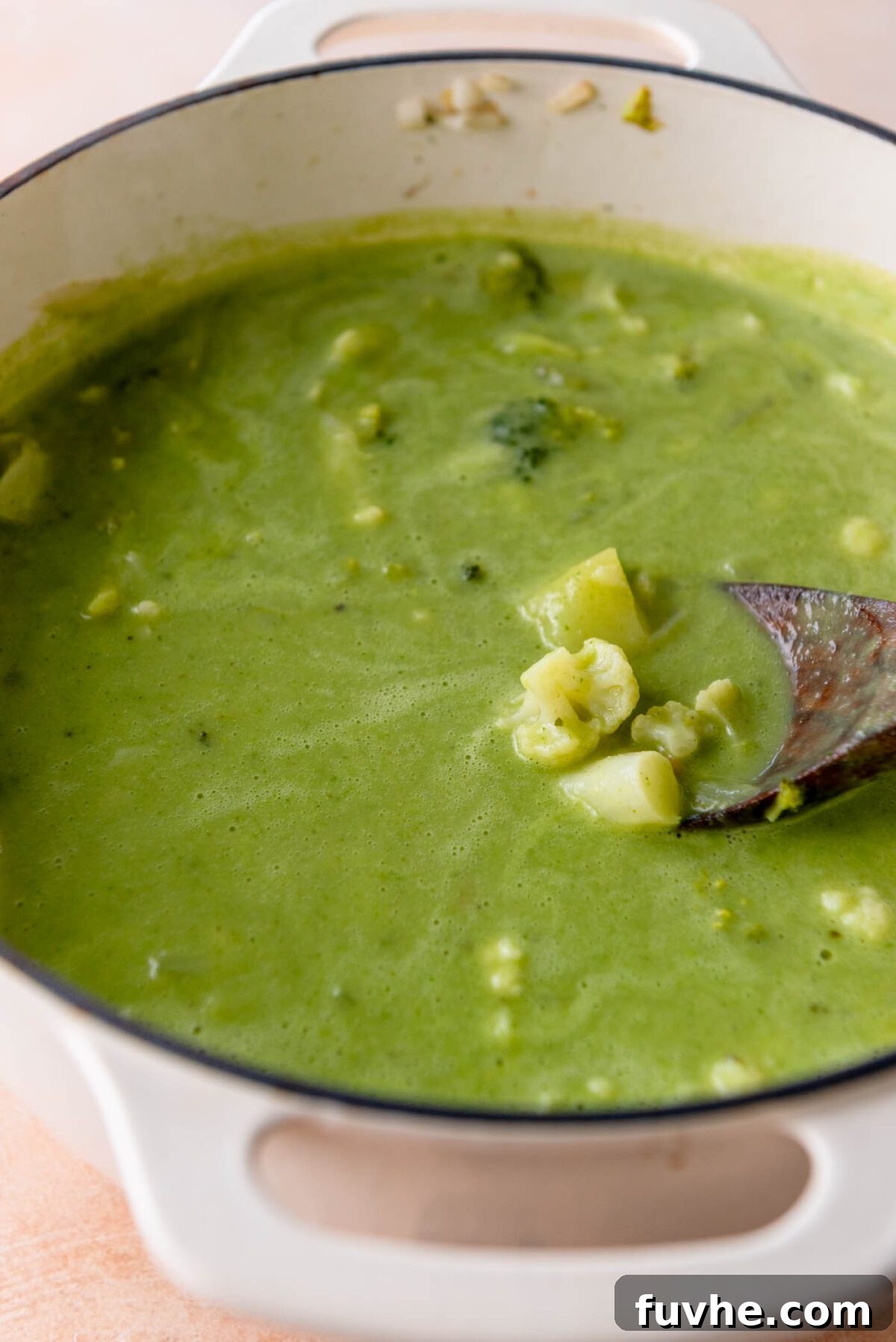 Velvety Vegan Broccoli & Cauliflower Bliss 8 The large pot of creamy vegan broccoli and cauliflower soup after blending, with a beautiful vibrant green hue.
