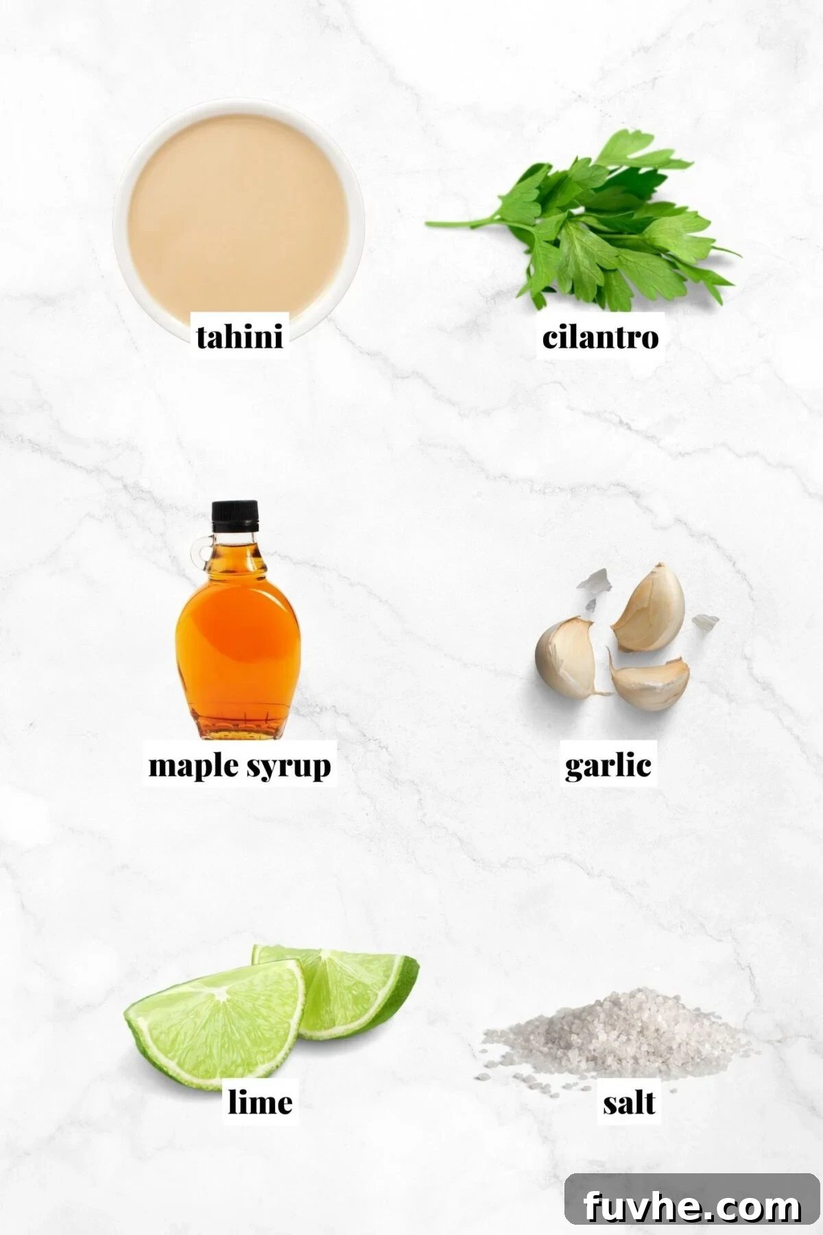 All the ingredients for making a creamy tahini sauce recipe with lime, cilantro and maple syrup.