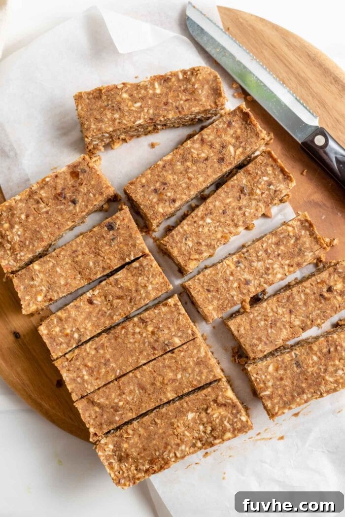 10 sliced energy bars on a cutting board. Knife rests beside bars.