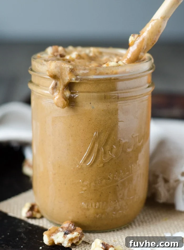 Creamy Vegan Pumpkin Spice Latte Smoothie topped with homemade caramel sauce, a perfect fall treat