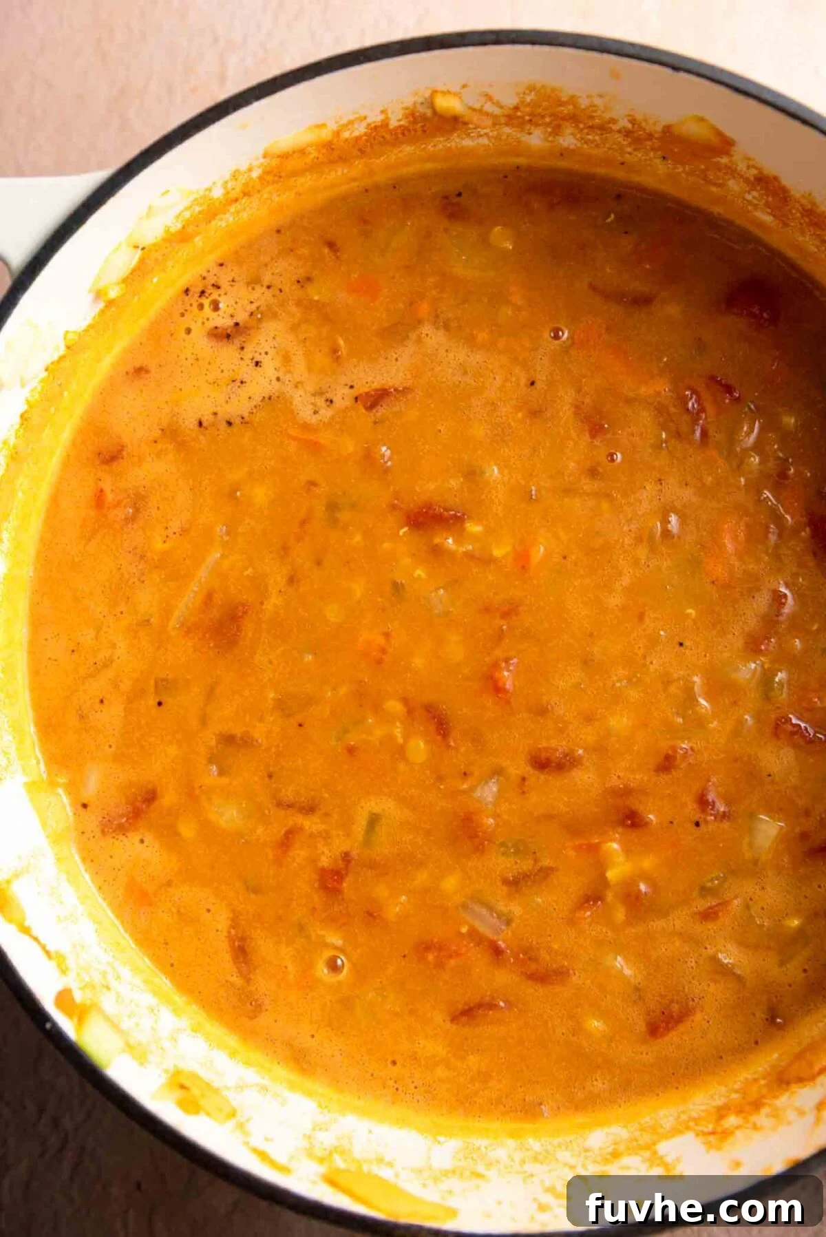 Curried tomato lentil chickpea soup in a large soup pot.