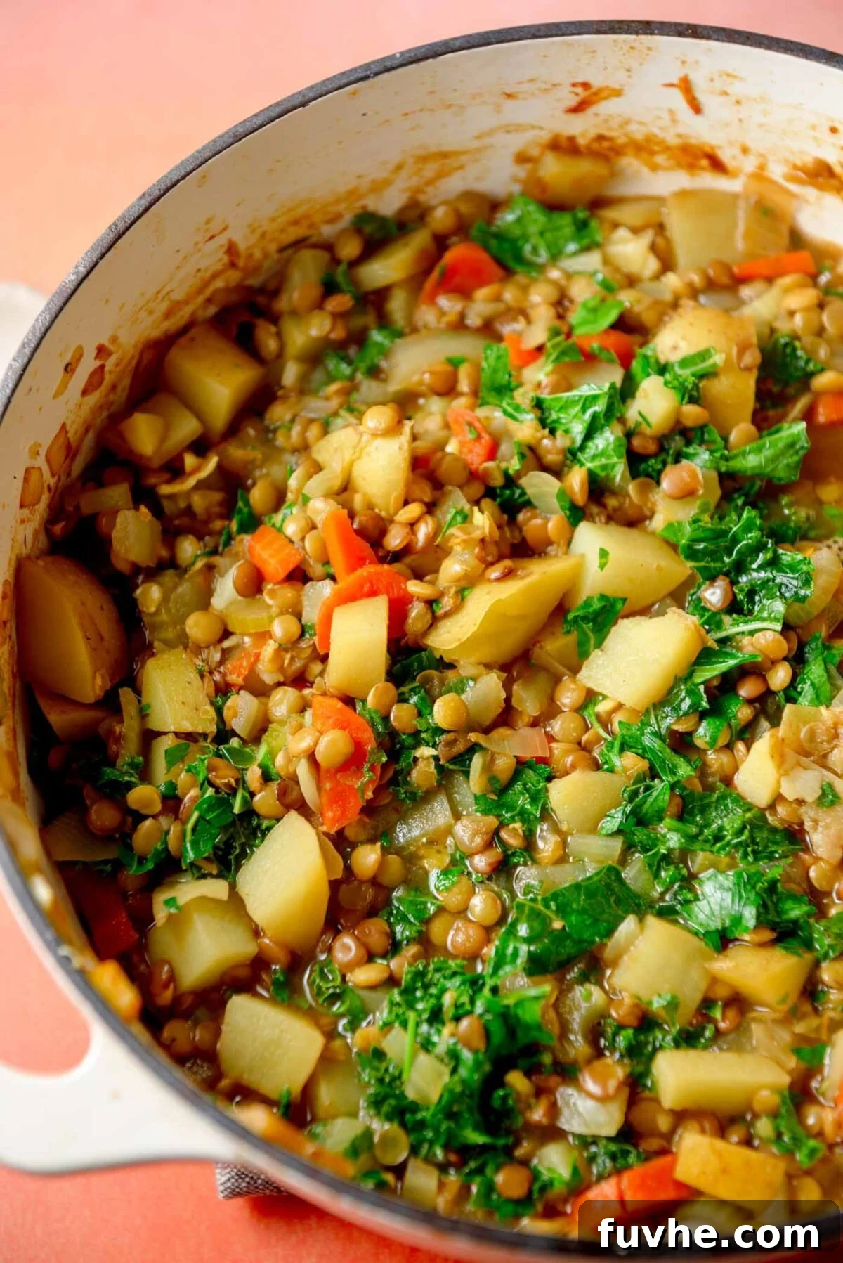 Hearty Lentil Potato Soup 8 Kale potato and lentil soup in a large pot.