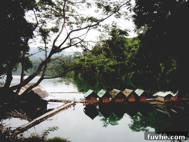 A row of peaceful floating huts on Chiew Lan Lake