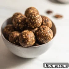 Raw banana bread balls arranged neatly in a bowl, showcasing their inviting texture.