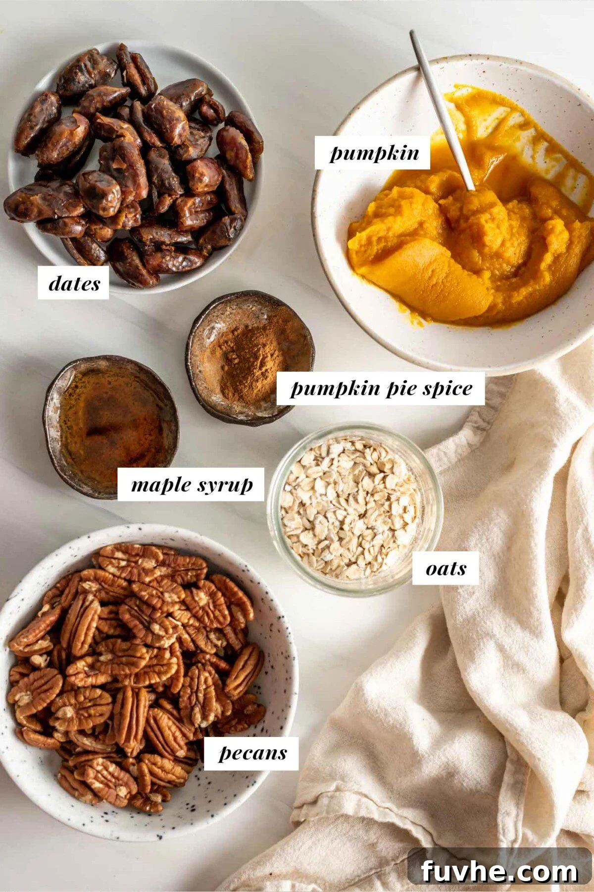 Pumpkin Spice Power Bites 3 Individual containers filled with raw pecans, rolled oats, soft pitted dates, smooth pumpkin puree, and fragrant pumpkin pie spice, ready for blending.