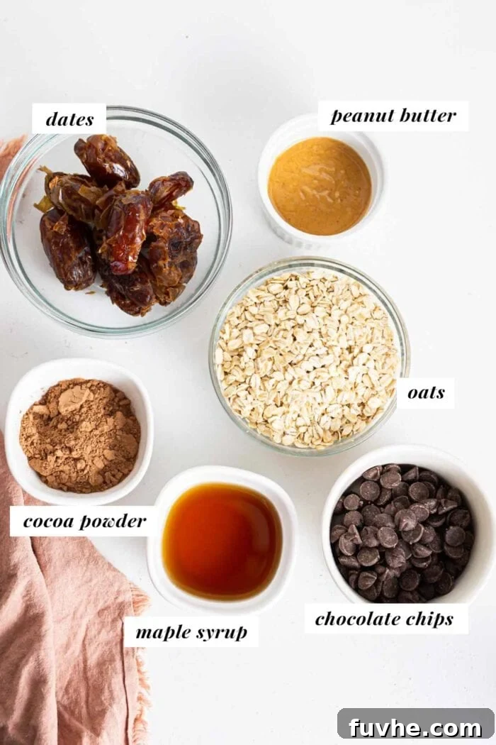 Bowls of dates, peanut butter, chocolate chips, and oats laid out on a kitchen counter, ready for baking.