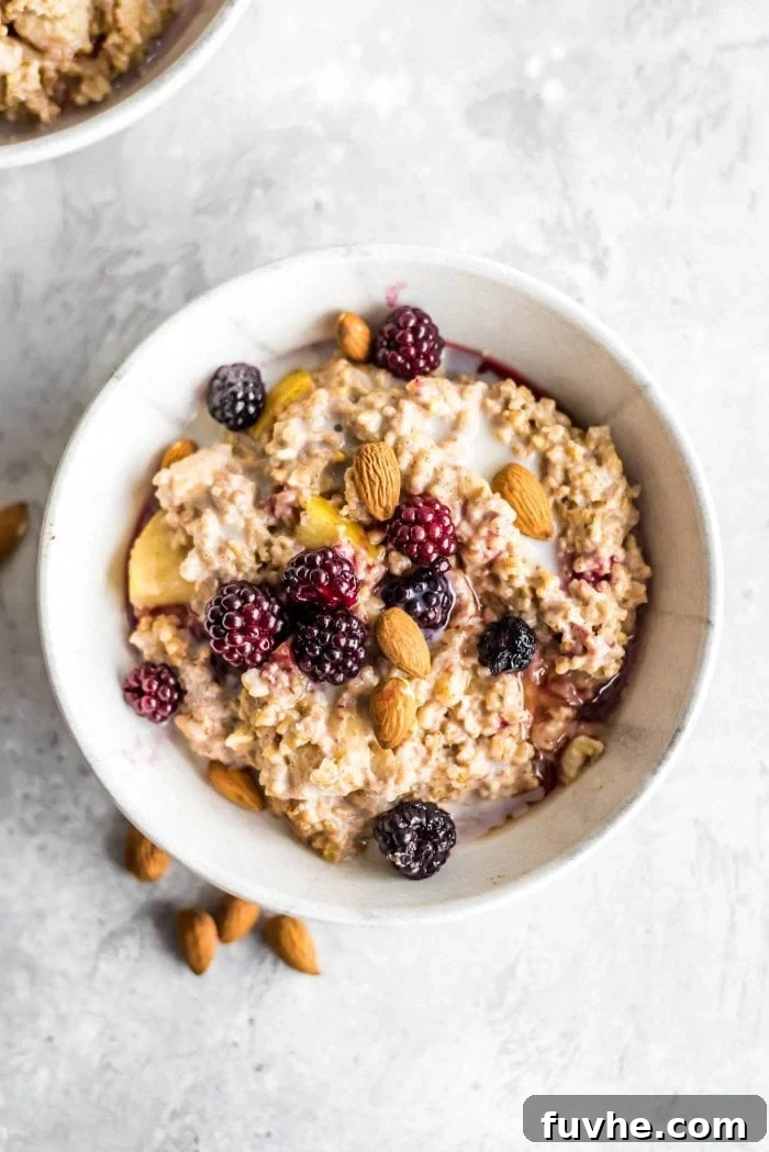 Plant-Based Macro Meal Blueprint 4 Hearty baked steel-cut oats, garnished with fresh berries and sliced almonds, a balanced vegan breakfast option.
