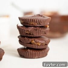 A stack of delightful vegan chocolate caramel cups, showcasing their appealing texture and rich color.