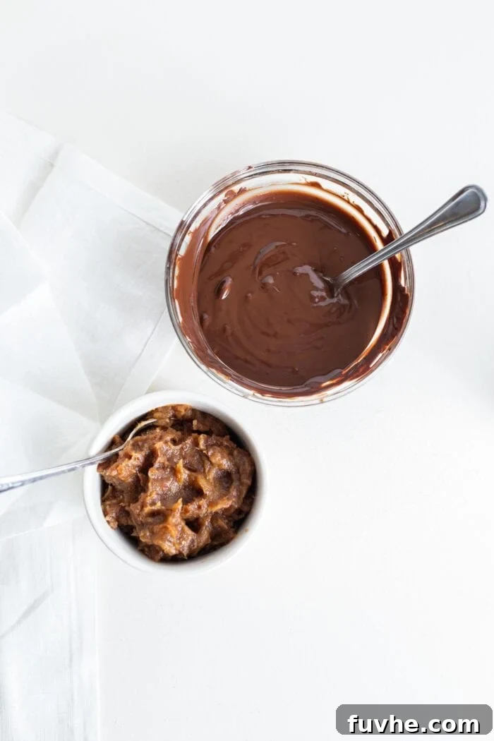 Melted chocolate and smooth date paste in separate small bowls, ready for assembly.
