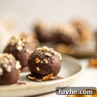 Salty Sweet Vegan Chocolate Truffles 10 Close up of a vegan chocolate truffle on a plate.