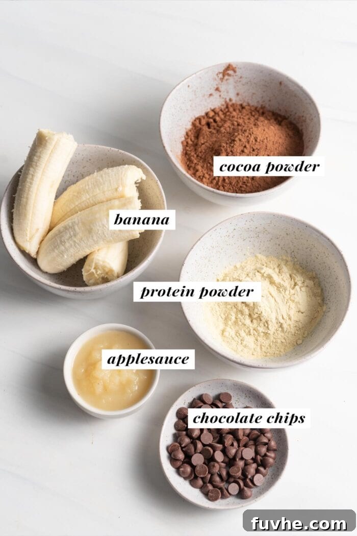 Plant-Powered Protein Brownies 3 Visual list of ingredients for making chocolate chip protein brownies, laid out neatly.