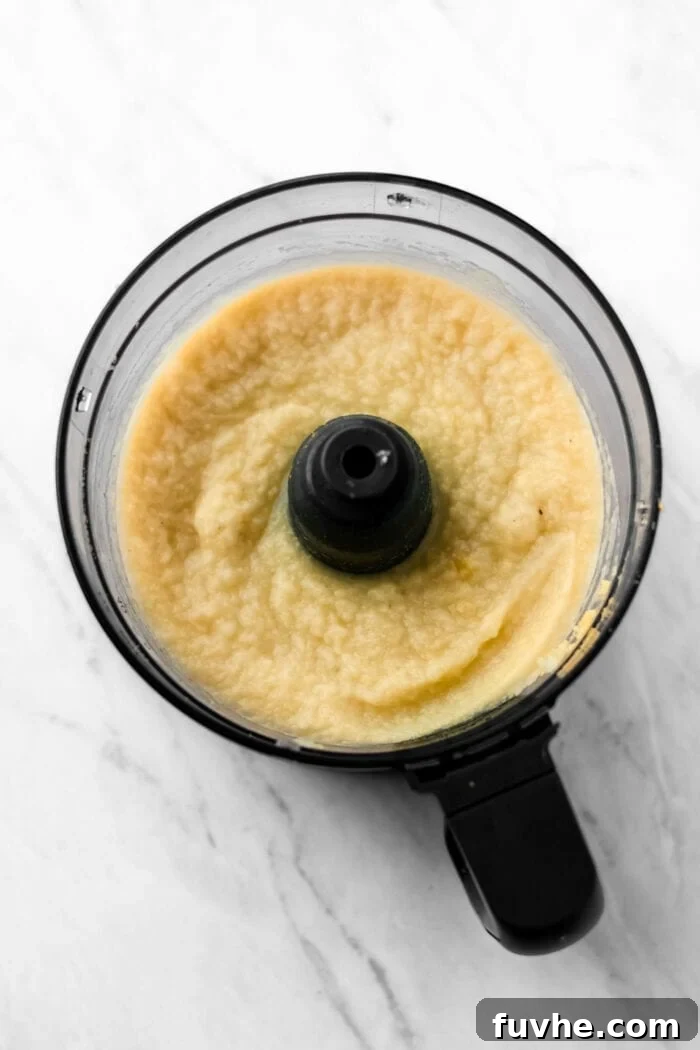 Creamy mashed cauliflower in a food processor.