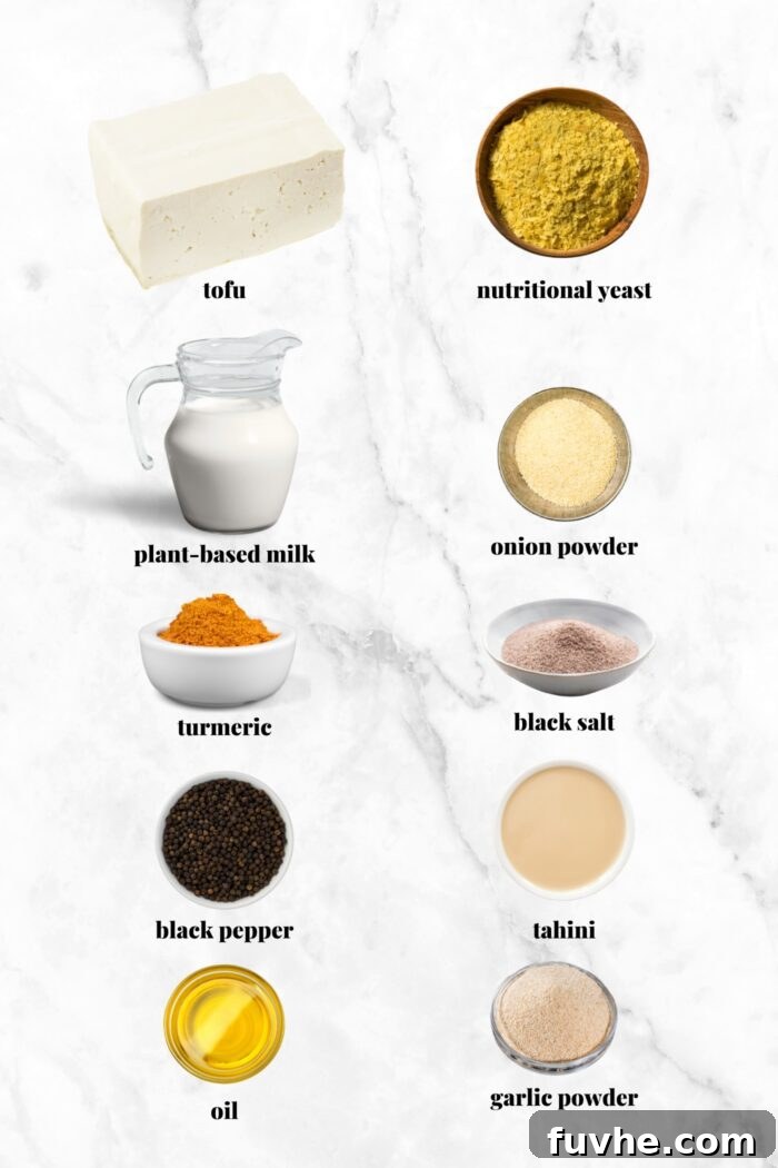 A beautifully arranged selection of all the fresh ingredients required to make a delicious and healthy tofu scramble, each thoughtfully labelled for clarity.