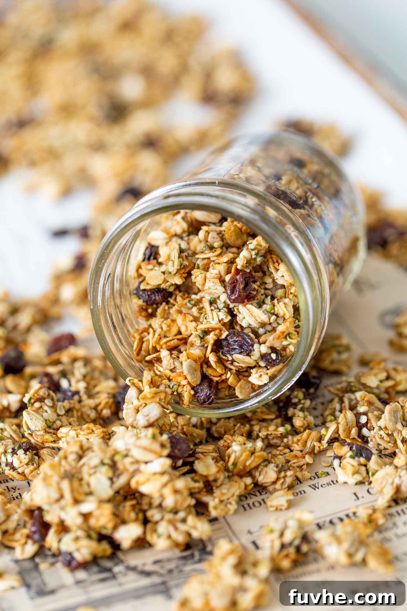 Guilt-Free Granola Crunch 5 Freshly baked granola stored in an elegant glass jar, placed on a baking tray, ready for serving or storage.