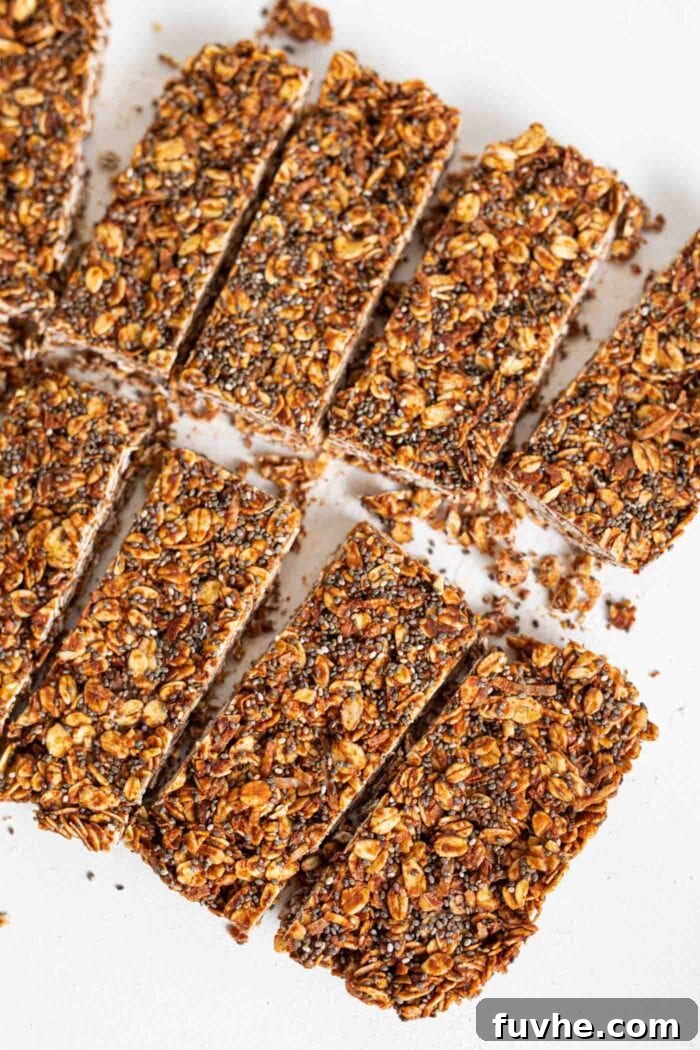 Eight perfectly uniform chocolate oat bars, neatly cut and arranged, inviting a taste of healthy deliciousness.