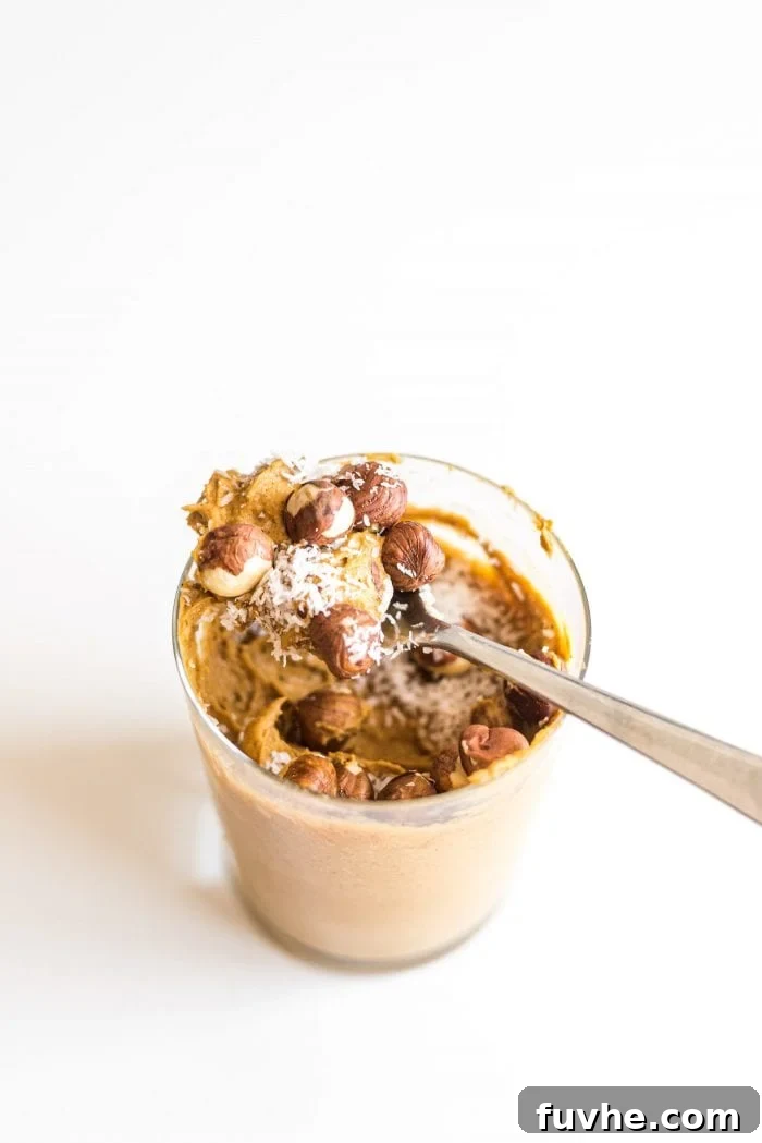 Pumpkin Power Pudding 4 Pumpkin pie protein pudding topped with hazelnuts and coconut.