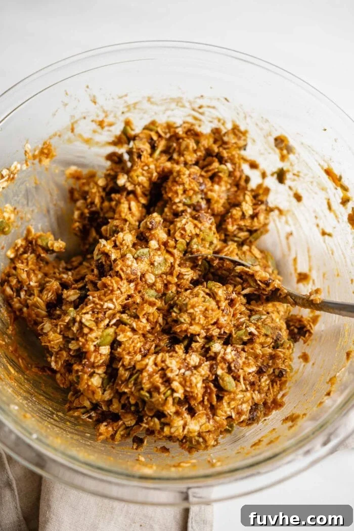 Sweet Potato Spice Cookies 5 Raw sweet potato cookie dough in a glass mixing bowl with a spoon, after all ingredients have been combined.